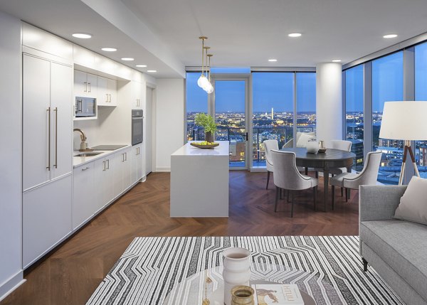 Modern kitchen with stainless steel appliances at The Commodore Apartments