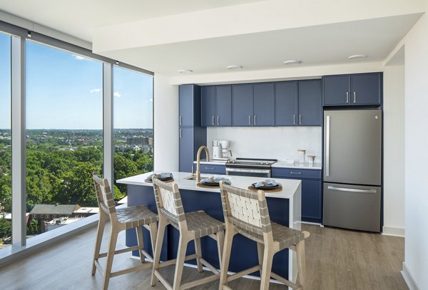 Modern kitchen with stainless steel appliances at Aventura Bellevue Apartments