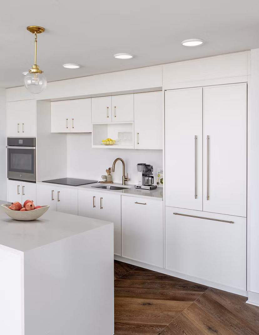 Modern kitchen with sleek countertops and stainless steel appliances at Aventura Bellevue Apartments, a luxury Greystar community