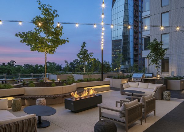 Cozy outdoor fire pit with seating at The Commodore Apartments, ideal for gathering and relaxation