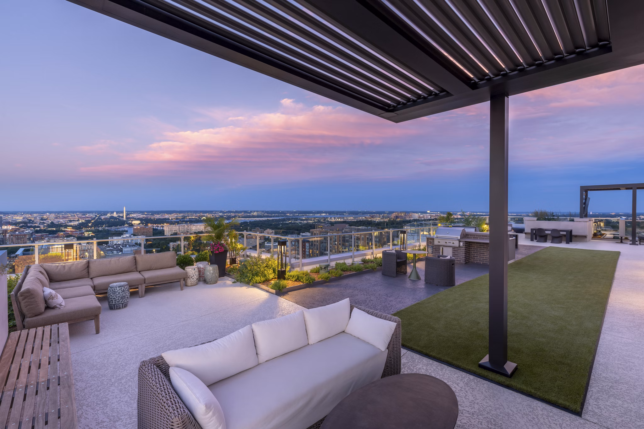 Rooftop deck with seating and city views at The Commodore Apartments, luxury living in the heart of the city
