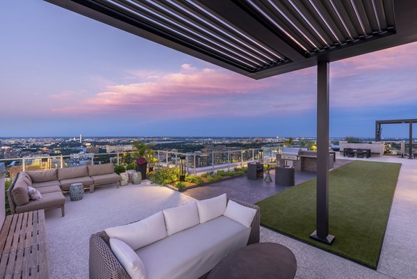 Rooftop deck with seating and city views at The Commodore Apartments, luxury living in the heart of the city