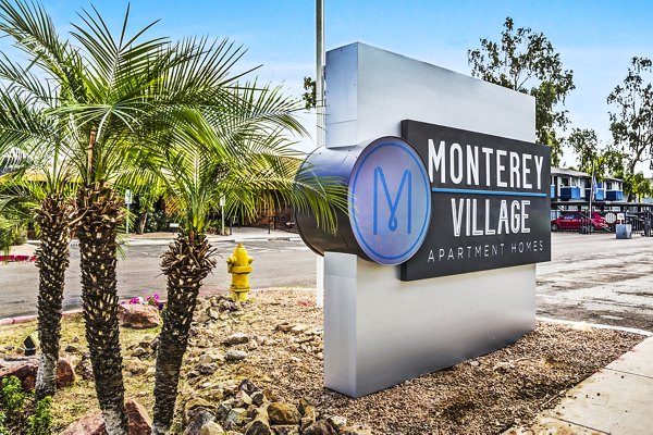 Monterey Village Apartments: Elegant signage at luxury apartment community entrance