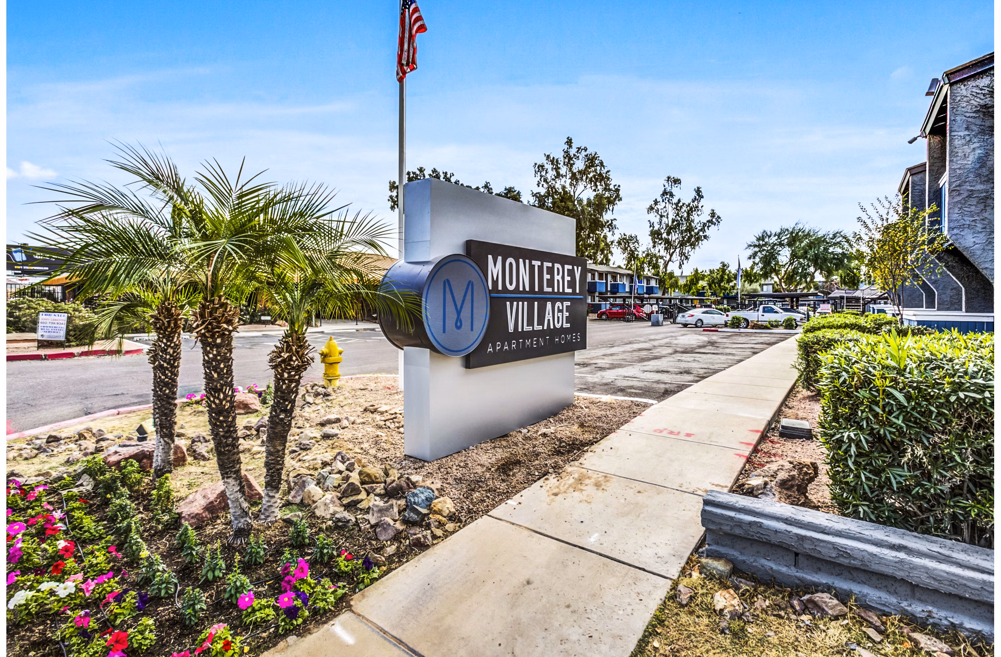 Monterey Village Apartments: signage showcasing luxury living options