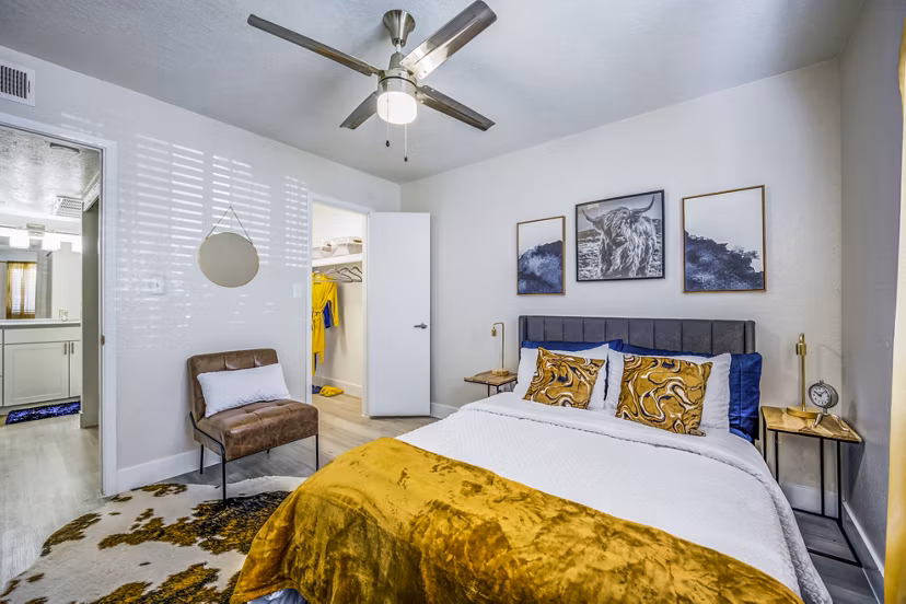 Cozy bedroom with modern design elements at Monterey Village Apartments