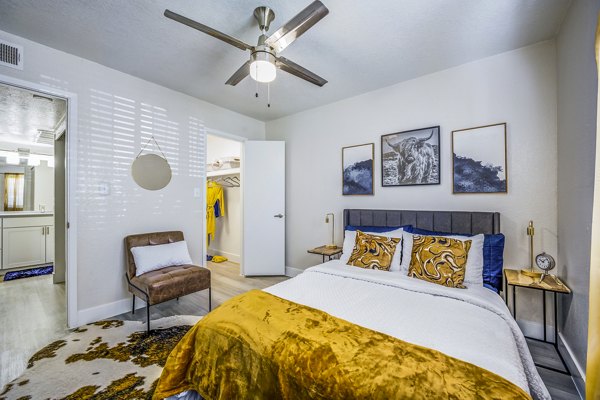 Cozy bedroom with modern design elements at Monterey Village Apartments