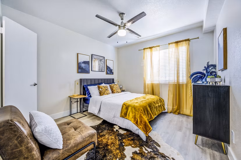 Luxurious bedroom with contemporary furnishings at Monterey Village Apartments