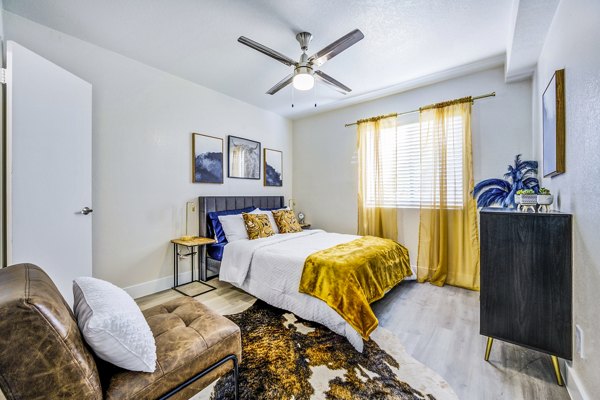 Luxurious bedroom with contemporary furnishings at Monterey Village Apartments