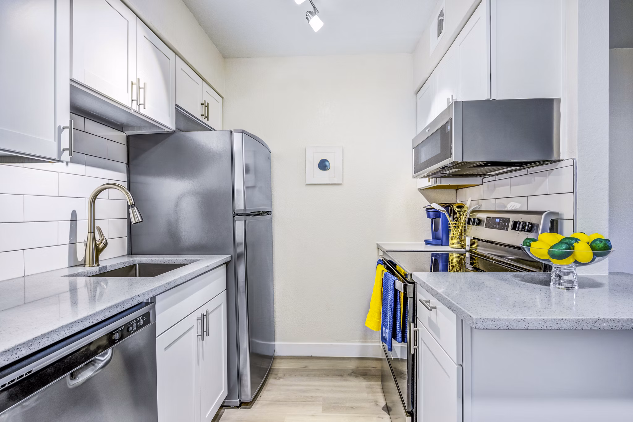 Monterey Village Apartments: Modern kitchen featuring stainless steel appliances and granite countertops