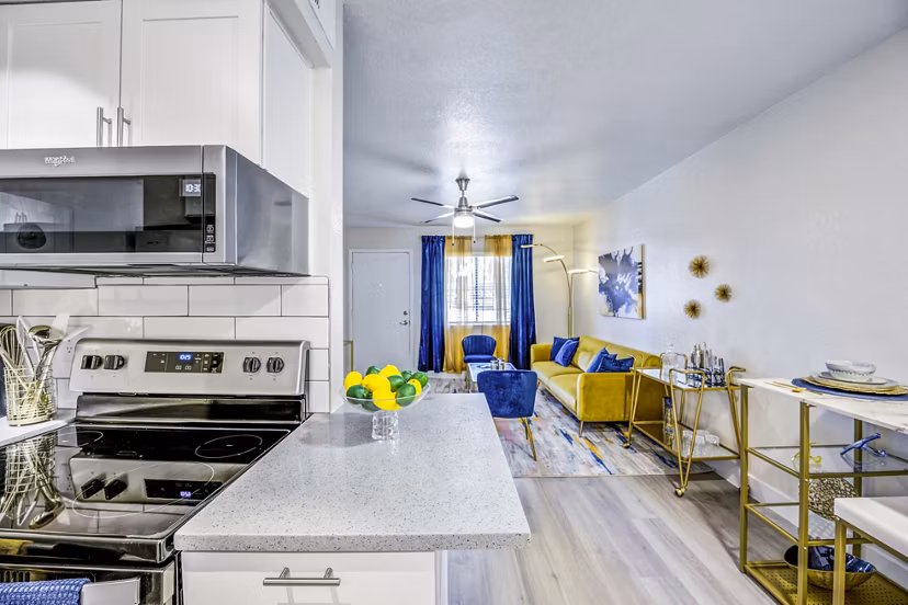 Modern kitchen with stainless steel appliances in Monterey Village Apartments
