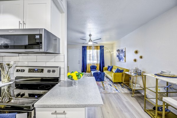 Modern kitchen with stainless steel appliances in Monterey Village Apartments