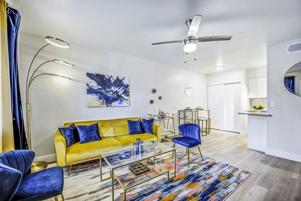 Spacious living room with modern decor at Monterey Village Apartments in luxury Greystar community