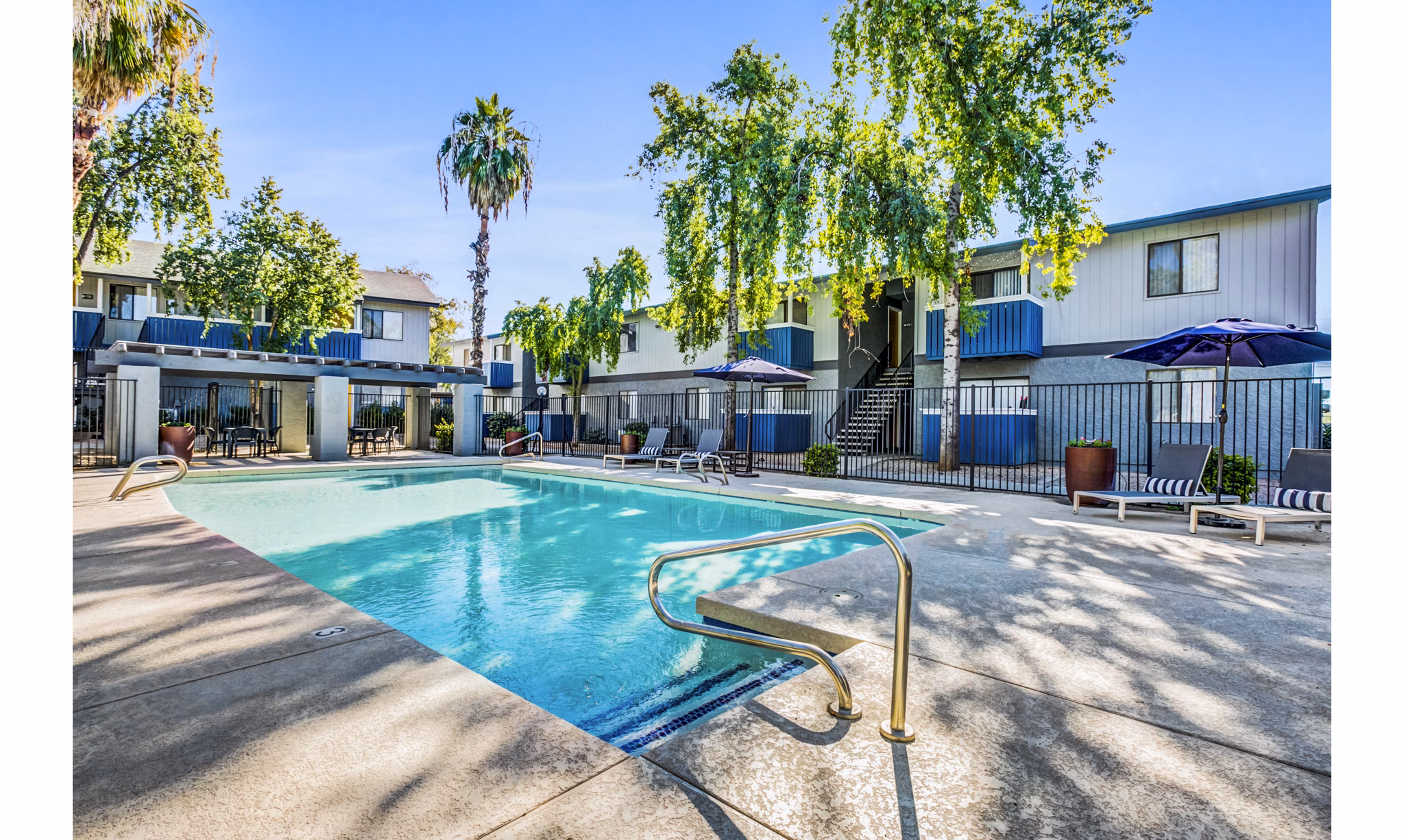 Resort-style pool area at Monterey Village Apartments
