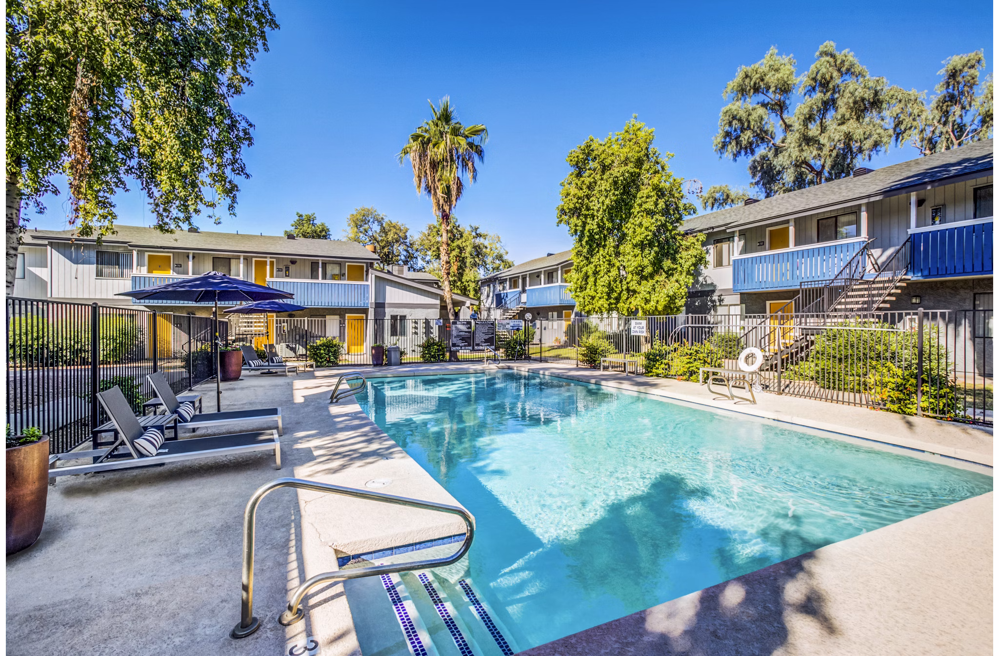 Luxury pool with cabanas at Monterey Village Apartments