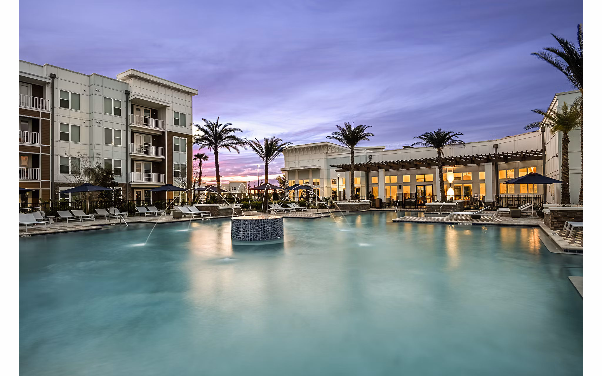 Aspire at Silverleaf Apartments: Modern outdoor pool area with lounge chairs