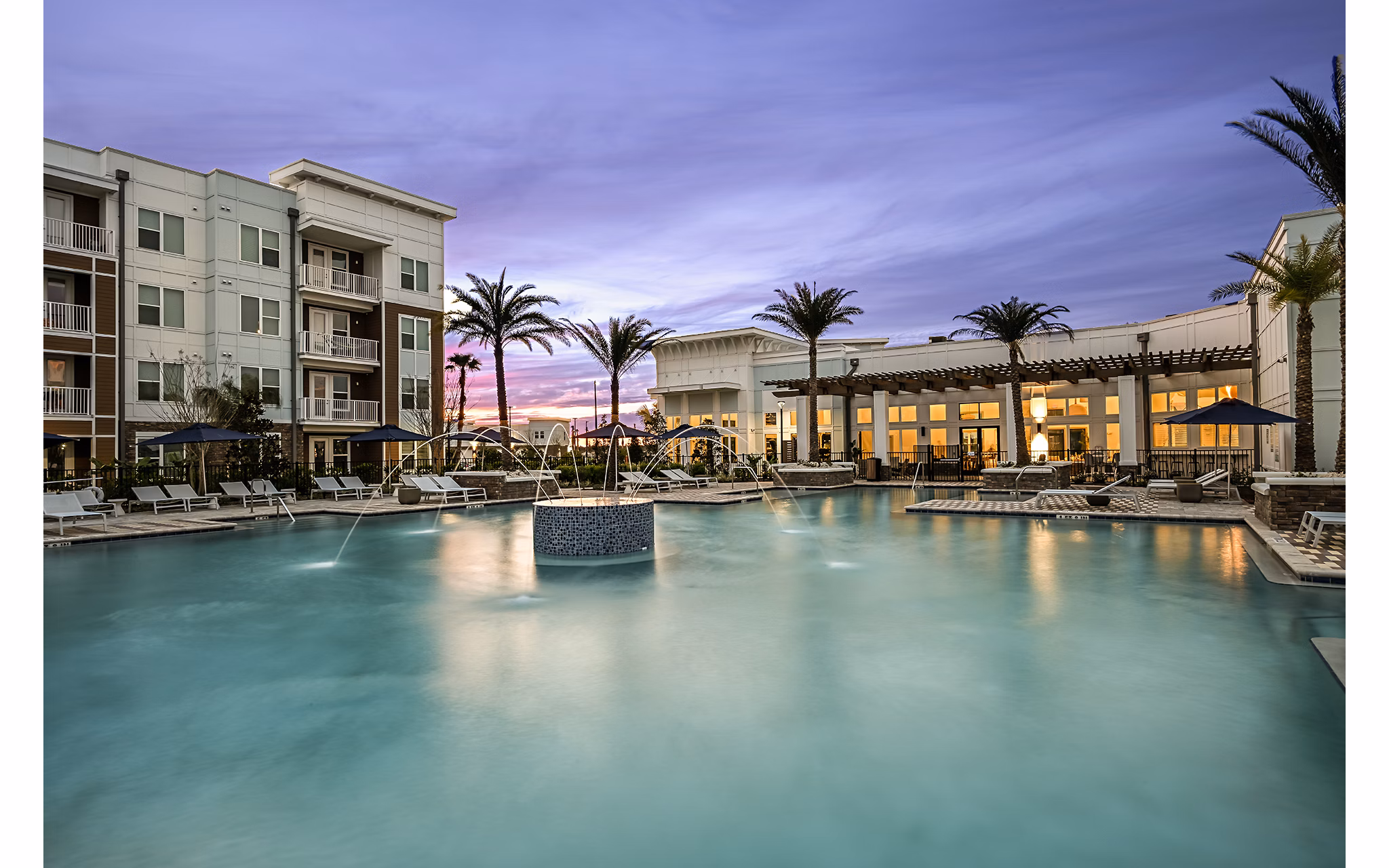 Aspire at Silverleaf Apartments: Modern outdoor pool area with lounge chairs