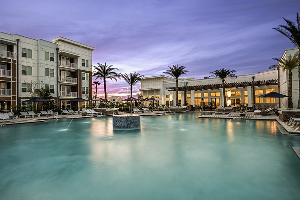 Aspire at Silverleaf Apartments: Modern outdoor pool area with lounge chairs