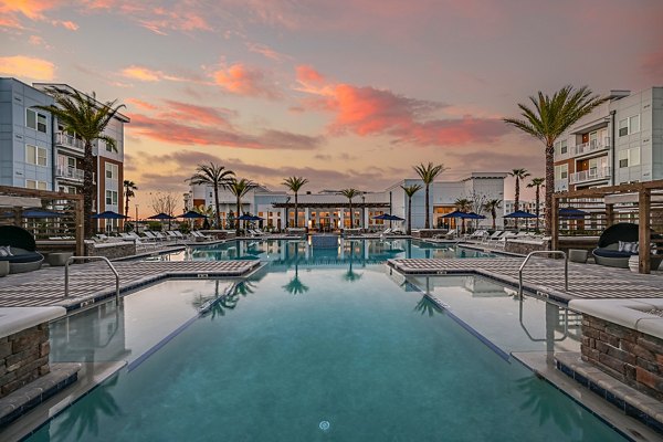 Aspire at Silverleaf: Outdoor pool with lounge chairs and cabanas at luxury apartments