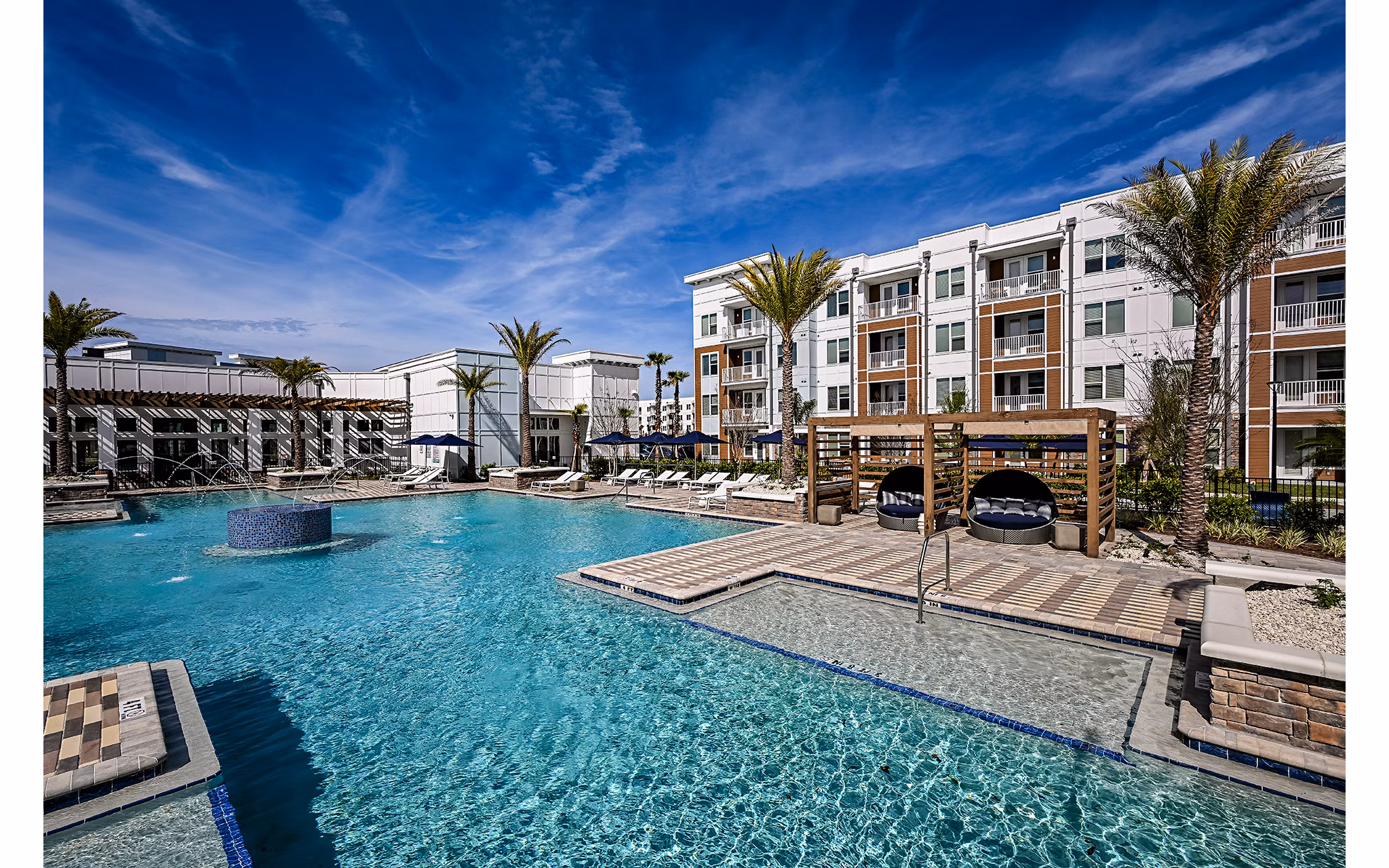 Resort-style pool at Aspire at Silverleaf Apartments offering luxury living in a serene environment