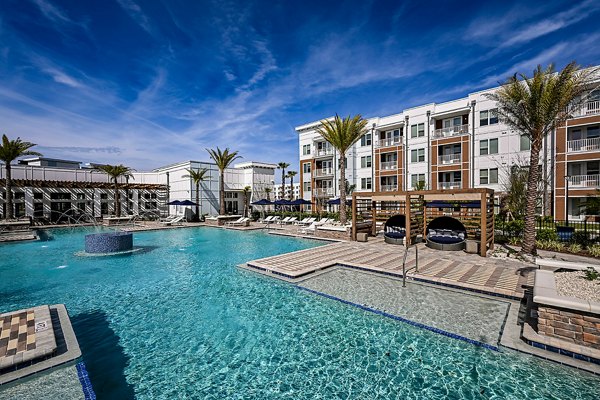 Resort-style pool at Aspire at Silverleaf Apartments offering luxury living in a serene environment