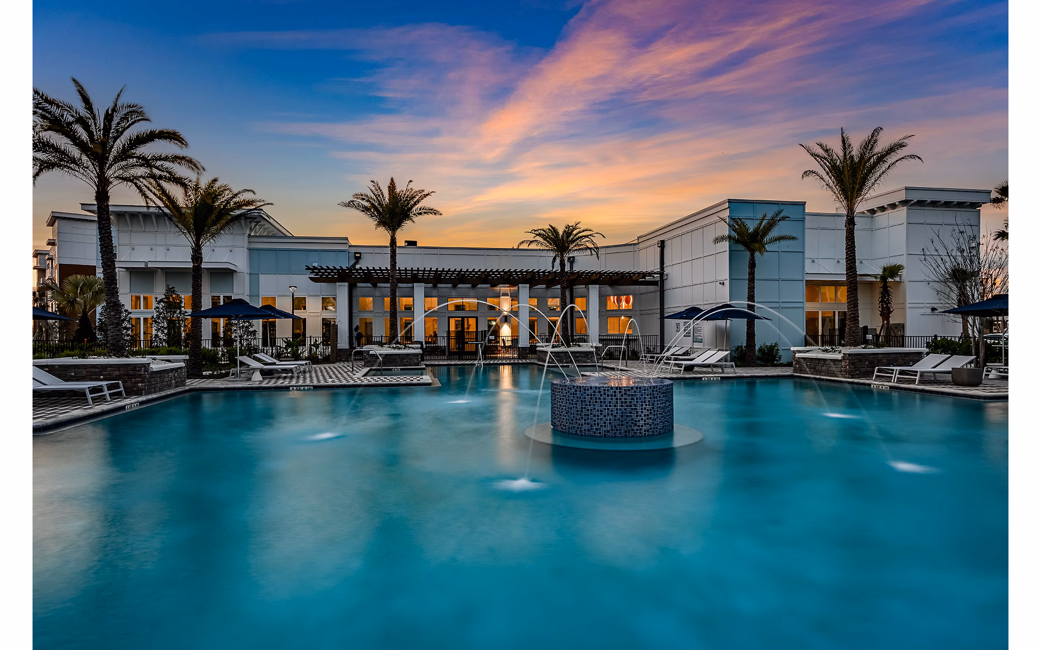 Resort-style pool at Aspire at Silverleaf Apartments offering relaxation and recreation for residents