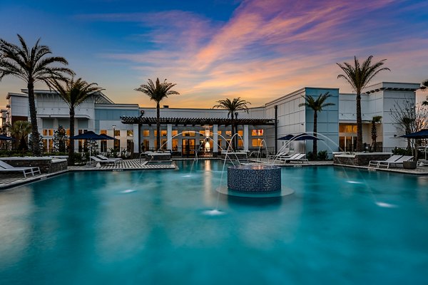 Resort-style pool at Aspire at Silverleaf Apartments offering relaxation and recreation for residents
