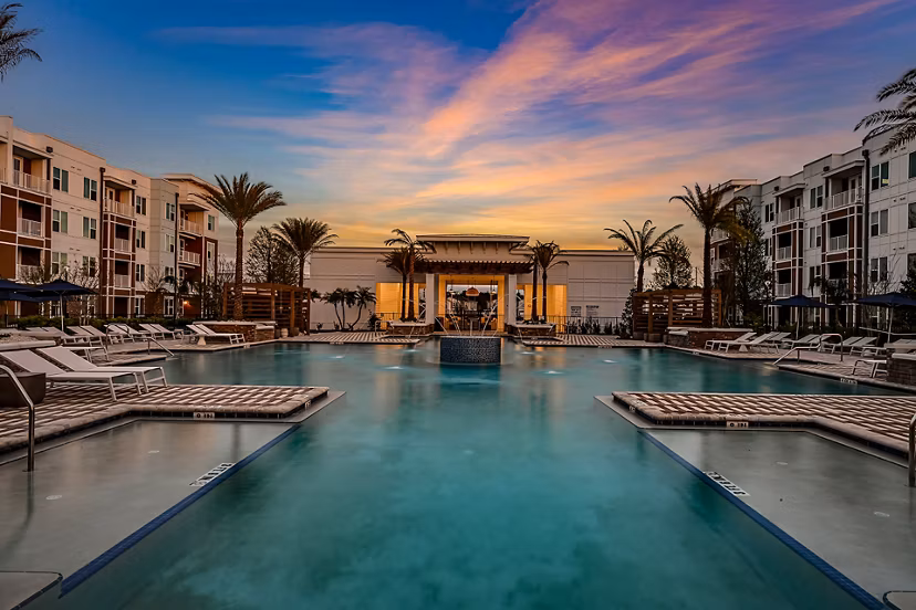 Aspire at Silverleaf: Luxury pool with lounge chairs for relaxation, perfect for residents seeking upscale apartment living