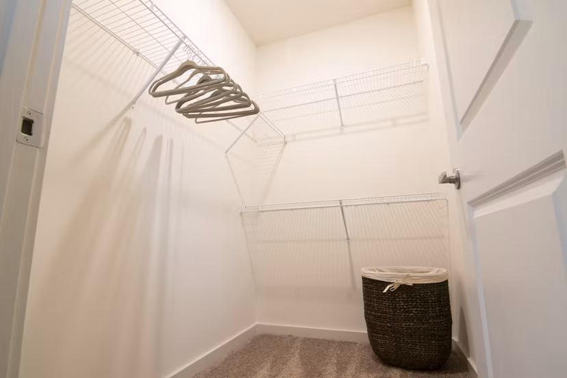 Spacious closet with shelving at Sage North Apartments, ideal for organized living and storage solutions