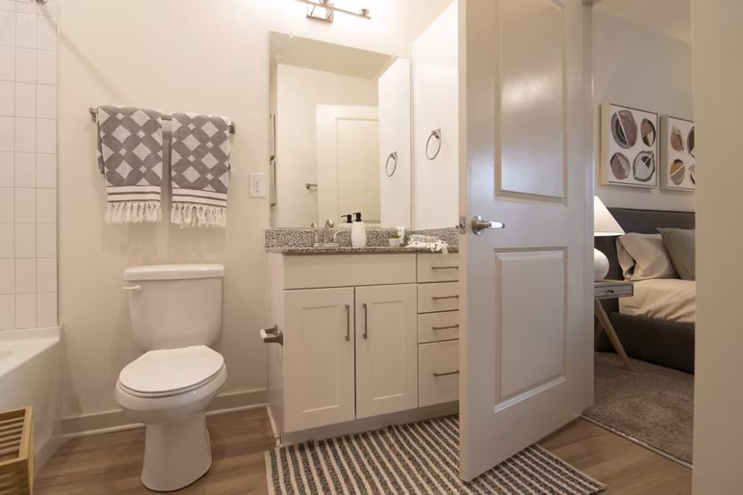 Luxurious bathroom with modern fixtures and marble accents at Sage North Apartments