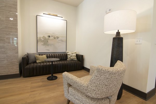 Elegant clubhouse featuring modern decor and seating at Sage North Apartments