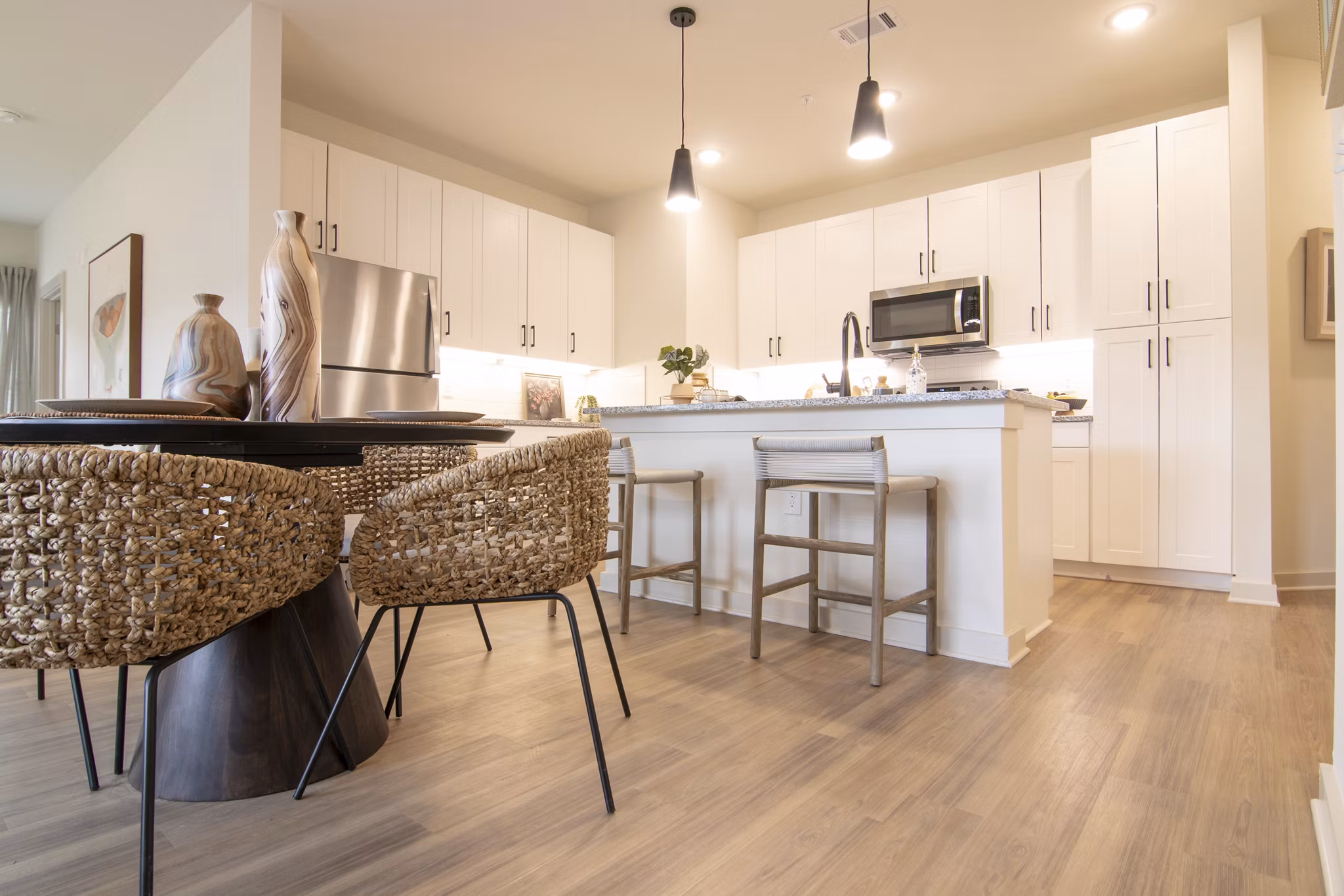 Elegant dining area with modern furnishings in Sage North Apartments, designed for luxury living at Greystar's premium property
