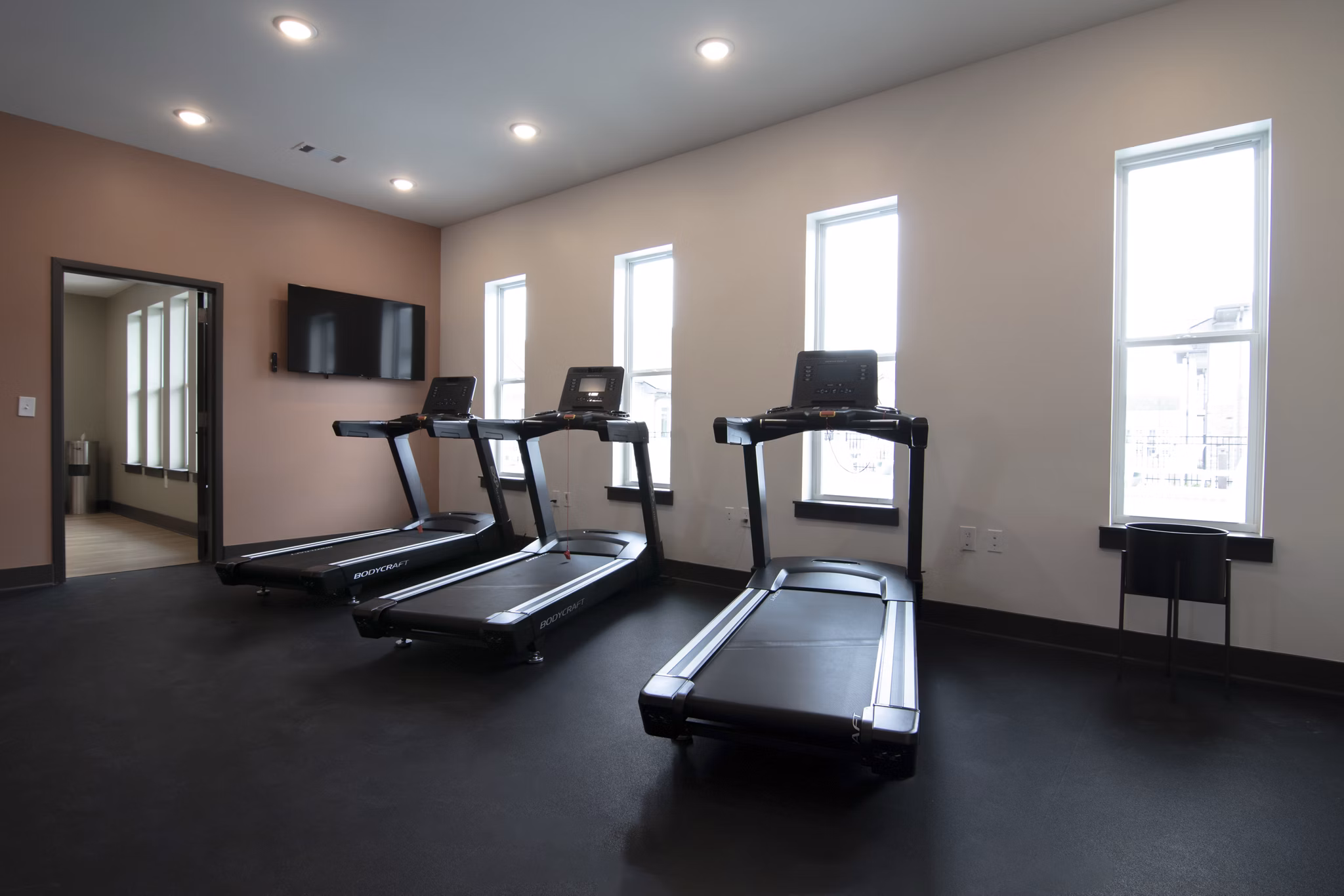 State-of-the-art fitness center with modern equipment at Prose Buda Apartments, offering luxury workout spaces