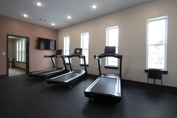State-of-the-art fitness center with modern equipment at Prose Buda Apartments, offering luxury workout spaces