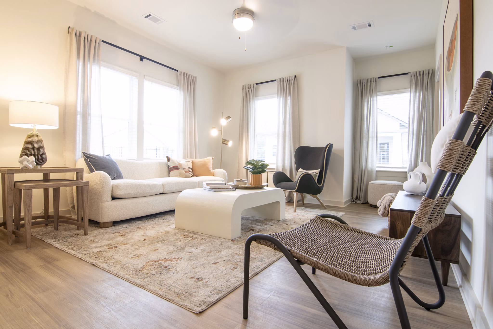 Contemporary living room with plush seating in Sage North Apartments