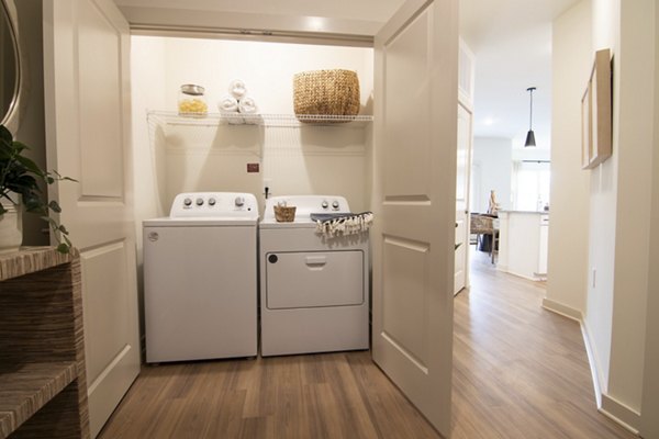 Laundry room with state-of-the-art washers and dryers at Sage North Apartments
