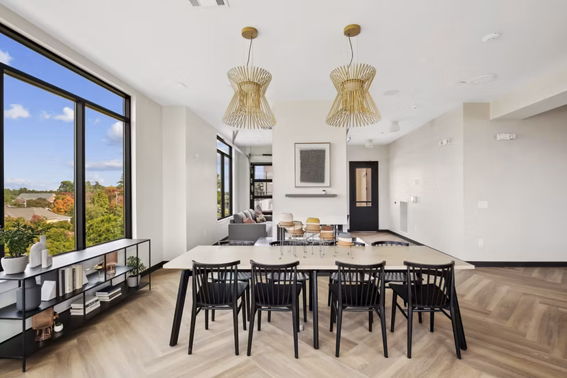 Clubhouse with modern furnishings and ample seating at 3500 West View Apartments, offering a relaxing community space for residents