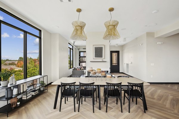 Clubhouse with modern furnishings and ample seating at 3500 West View Apartments, offering a relaxing community space for residents