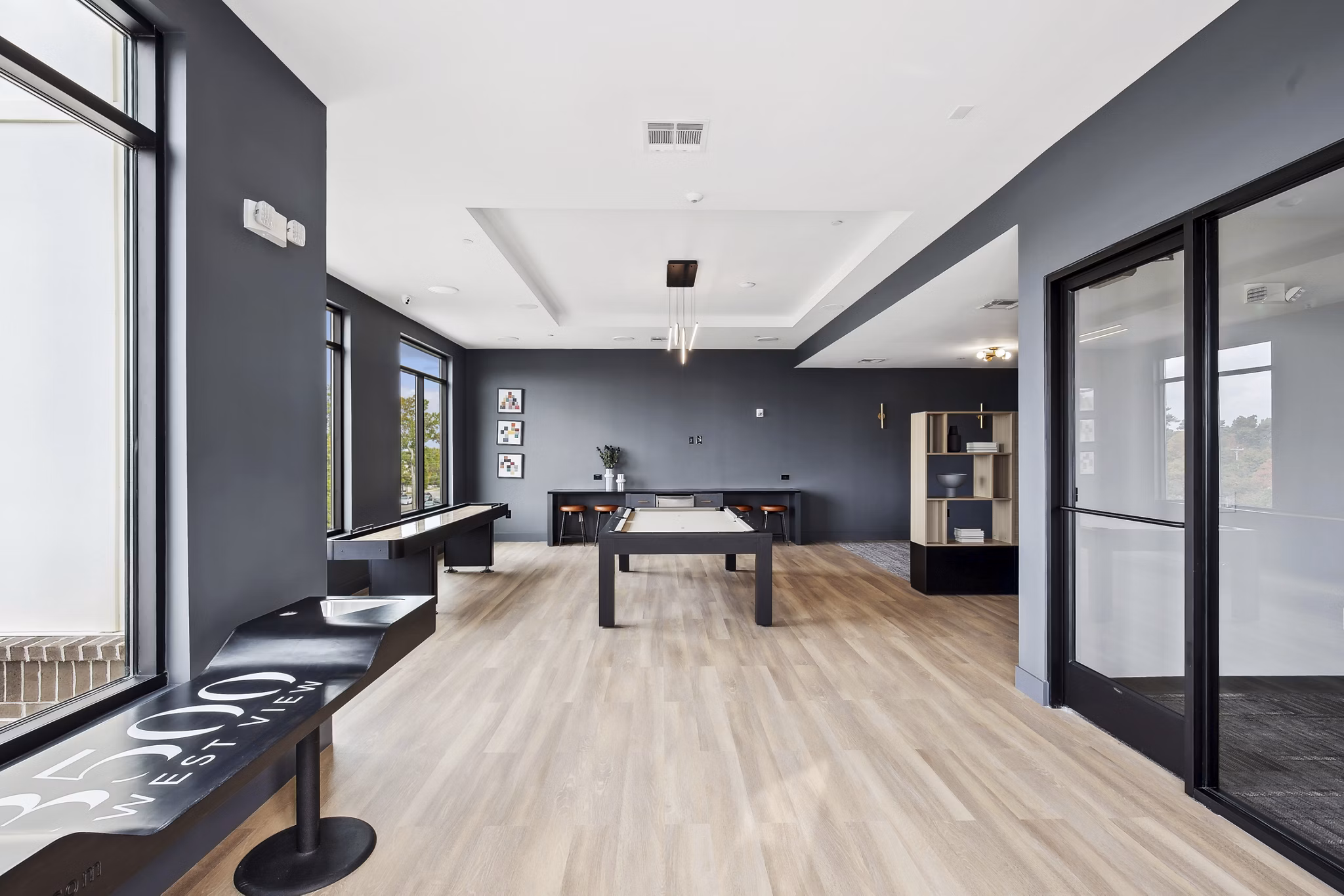 Clubhouse featuring modern decor and ample seating at 3500 West View Apartments luxury community