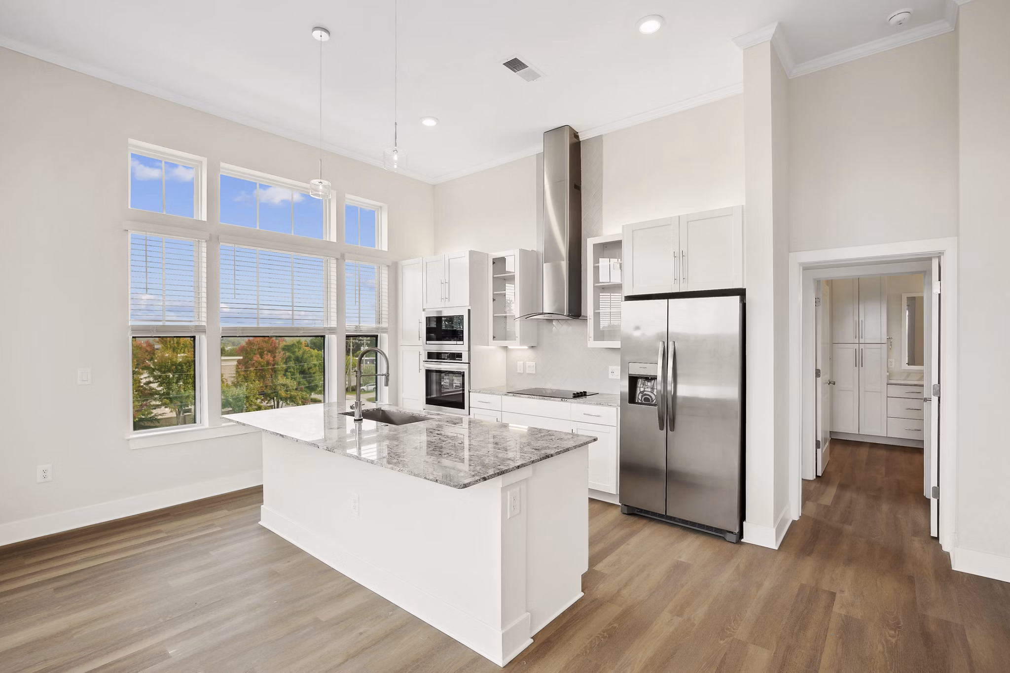 Modern kitchen featuring stainless steel appliances and granite countertops at 3500 West View Apartments