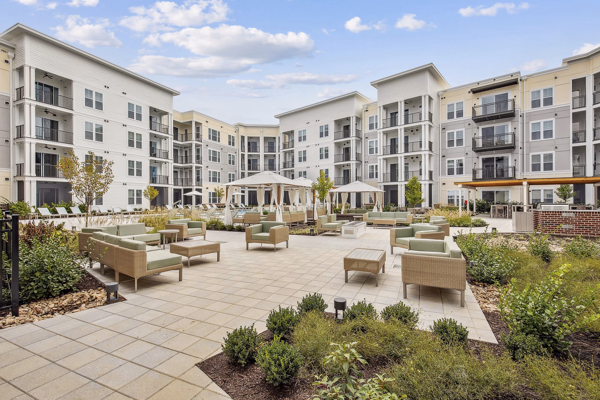 Serene courtyard at 3500 West View Apartments featuring lush landscaping and modern seating areas for relaxation