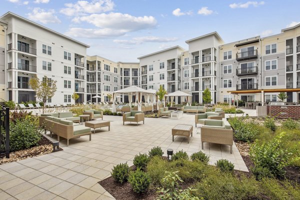 Serene courtyard at 3500 West View Apartments featuring lush landscaping and modern seating areas for relaxation