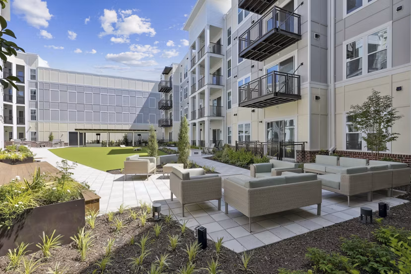 Outdoor courtyard with modern seating and greenery at 3500 West View Apartments, a luxury community