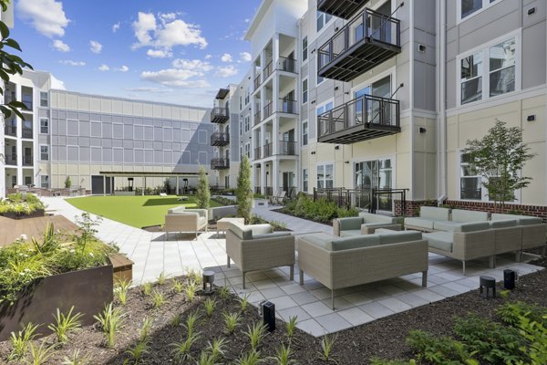 Outdoor courtyard with modern seating and greenery at 3500 West View Apartments, a luxury community