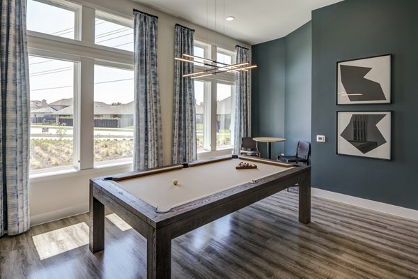Clubhouse with modern seating and entertainment options at Prose Prominence Apartments