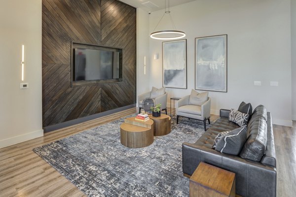 Clubhouse featuring modern seating and vibrant decor at Prose Prominence Apartments