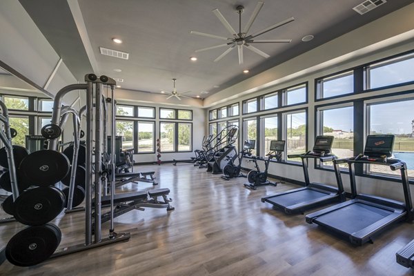 State-of-the-art fitness center with modern equipment at Prose Prominence Apartments