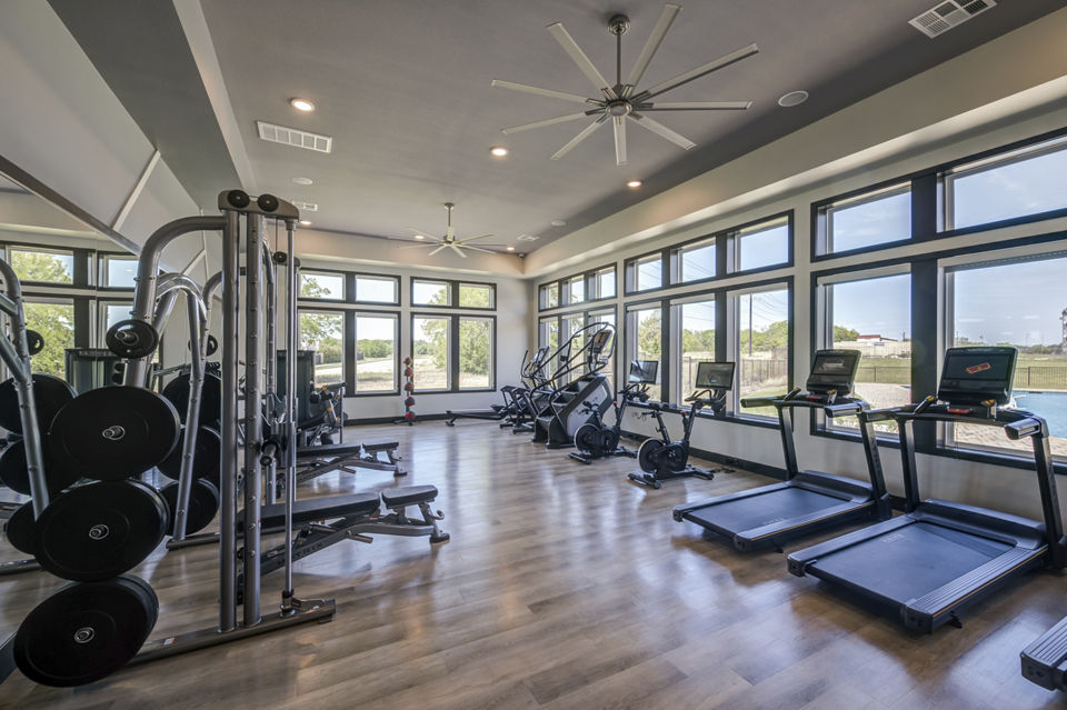 State-of-the-art fitness center with modern equipment at Prose Prominence Apartments