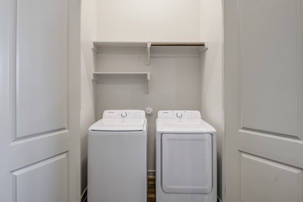 Laundry room with state-of-the-art appliances in Prose Prominence Apartments