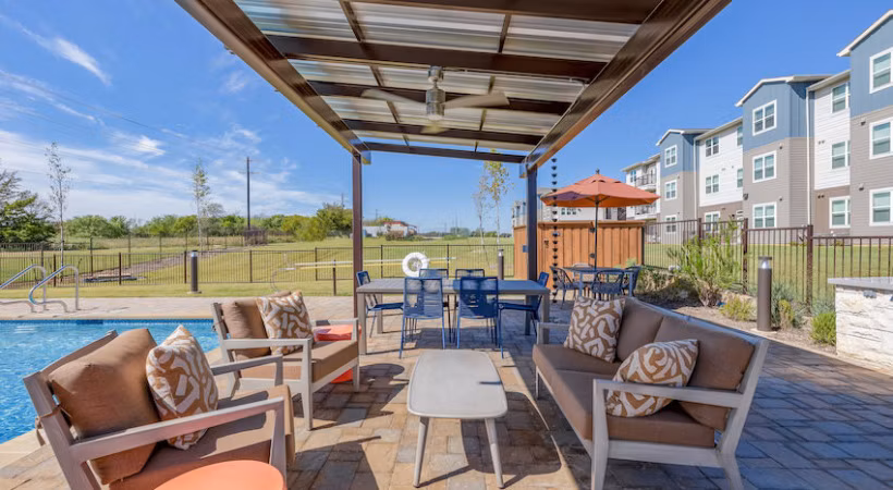 Prose Prominence: Scenic patio in luxury apartment community perfect for outdoor relaxation