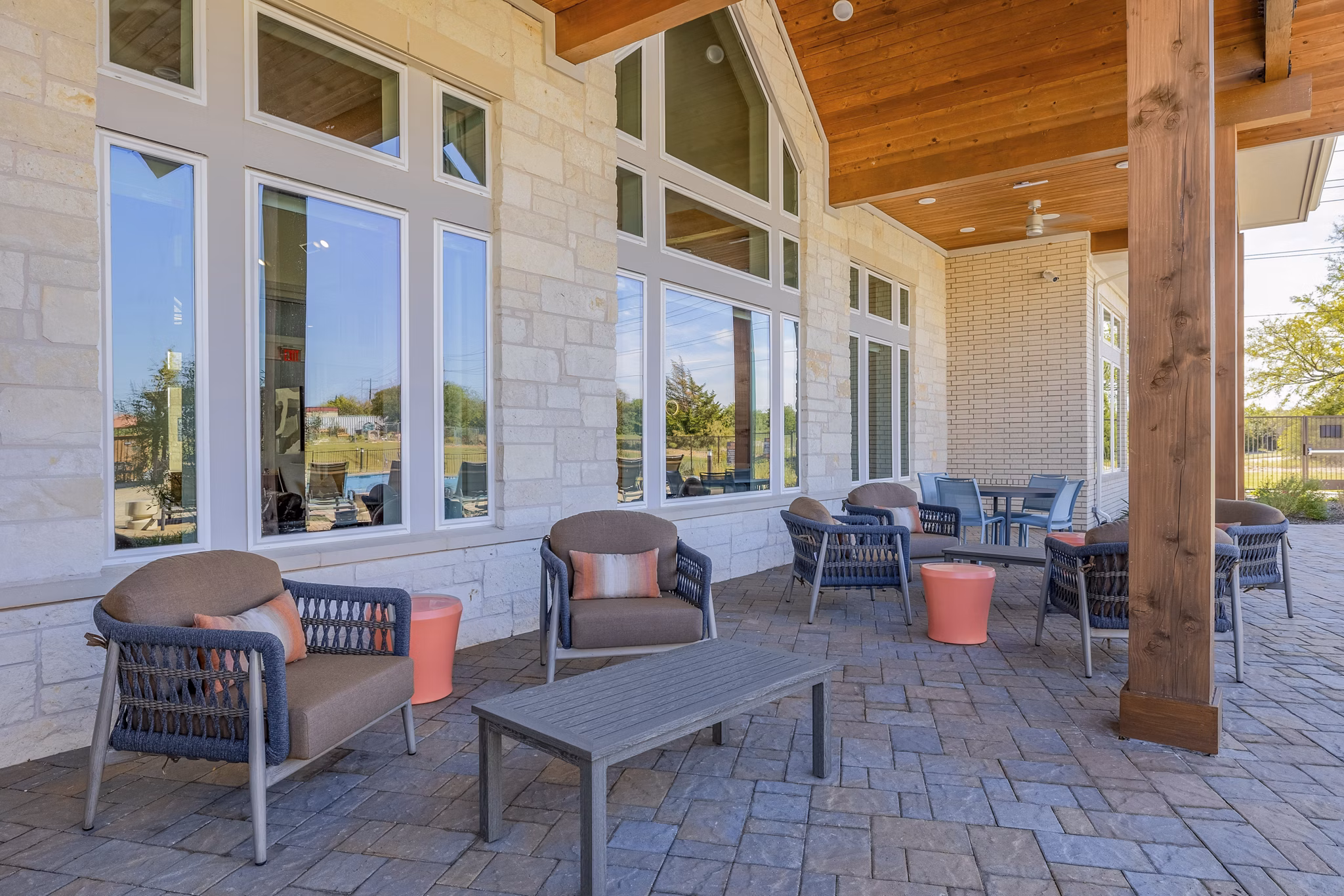 Stylish outdoor patio with comfortable seating at Prose Prominence Apartments